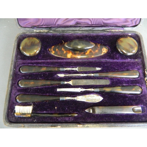 129 - A C19th cased tortoiseshell manicure set by Drew & Sons, 9½