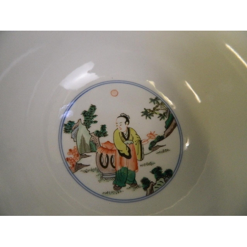 130 - A Chinese famille verte enamel porcelain bowl decorated with figures in a temple, 6 character mark t... 