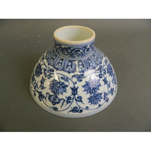 142 - A Chinese blue and white porcelain footed bowl decorated with lotus flowers and the eight Buddhist s... 