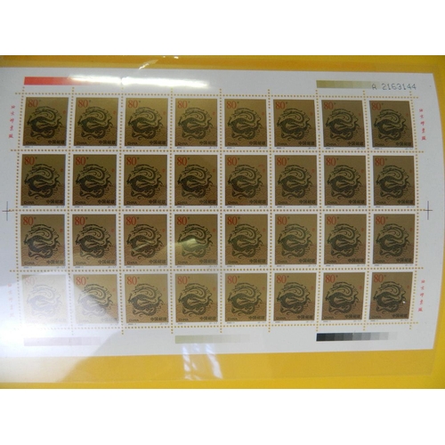 144 - A wallet of facsimile Chinese stamp sheets commemorating the new millennium, 8