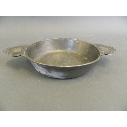 145 - A large pewter quaich with embossed handles, 6