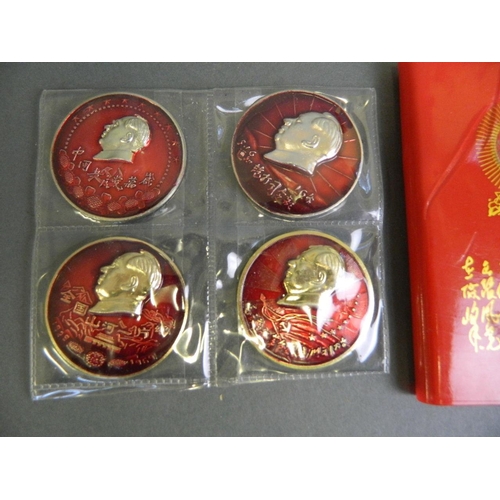 146 - Four enamelled metal medals decorated with Chairman Mao, together with his red book, 3½