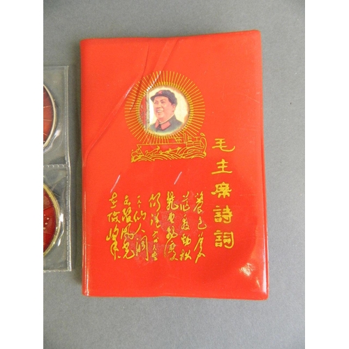 146 - Four enamelled metal medals decorated with Chairman Mao, together with his red book, 3½