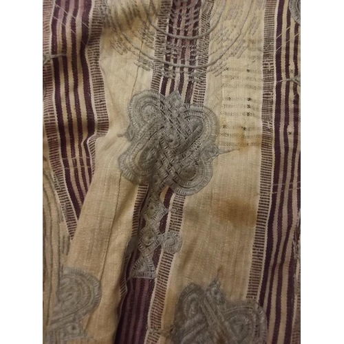 150D - A Middle Eastern linen robe with silk embroided decoration, 47