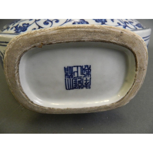 154 - A Chinese blue and white porcelain moon flask with twin elephant mask handles and scrolling lotus fl... 