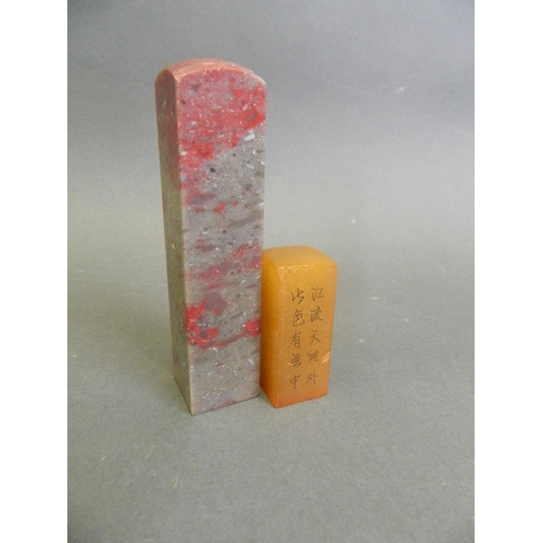 155 - A Chinese chicken blood soapstone seal, together with an amber soapstone seal, largest 4