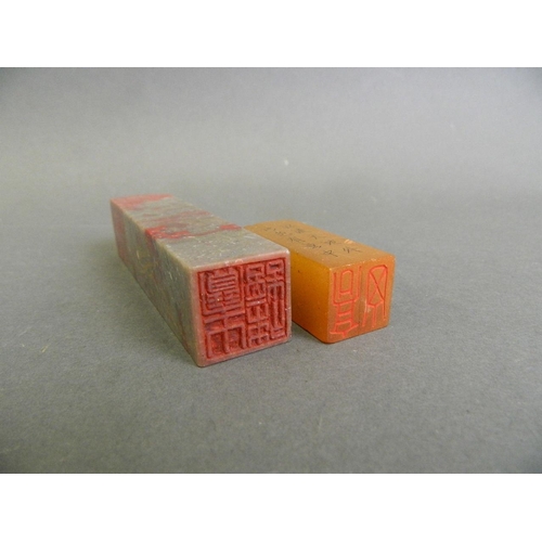 155 - A Chinese chicken blood soapstone seal, together with an amber soapstone seal, largest 4