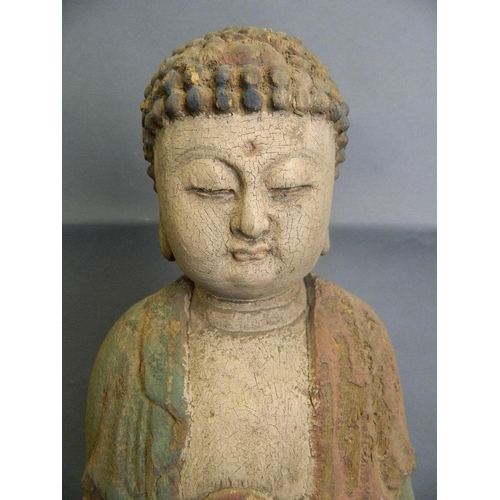 158 - An early Chinese carved and painted wood figure of Buddha, 23