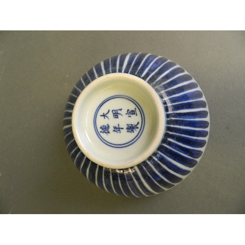 162 - A Chinese blue and white porcelain bowl with scrolling floral decoration, 6 character mark to base, ... 