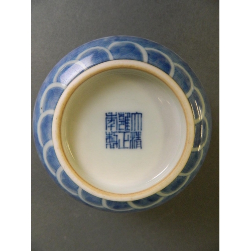 166 - A Chinese blue and white porcelain rice bowl decorated with twin dragons chasing the flaming pearl, ... 