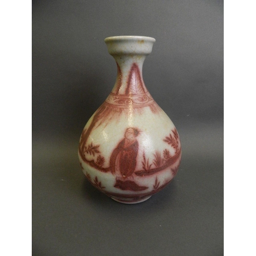 178 - A Chinese red and white pottery pear shaped vase decorated with figures in a garden setting, 12