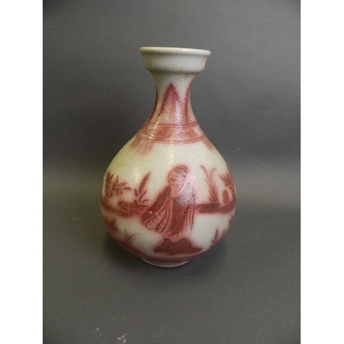 178 - A Chinese red and white pottery pear shaped vase decorated with figures in a garden setting, 12