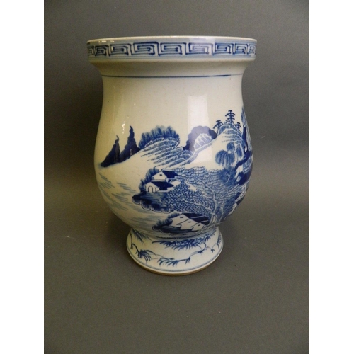 202 - A Chinese blue and white porcelain footed vase decorated with an extensive riverside village, 6 char... 