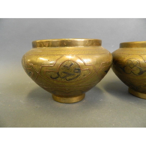 205 - A pair of bronze Cario ware bowls with mixed metal inlay decoration, 5