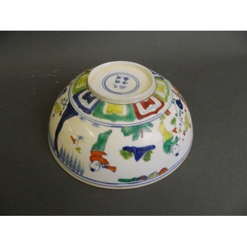 206 - A Chinese Doucai enamelled eggshell porcelain bowl decorated with boys playing in a garden, 6 charac... 