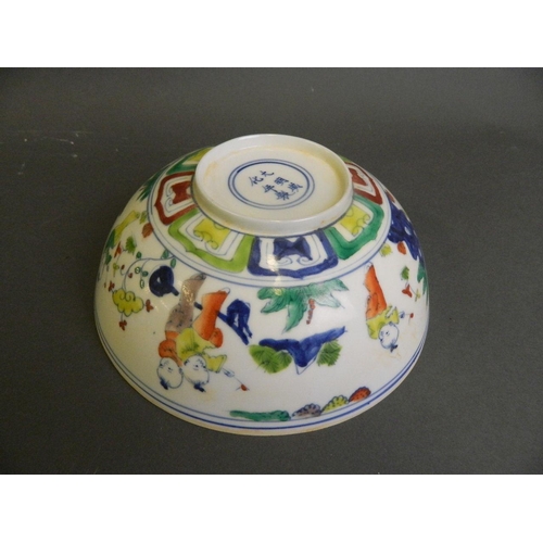 206 - A Chinese Doucai enamelled eggshell porcelain bowl decorated with boys playing in a garden, 6 charac... 