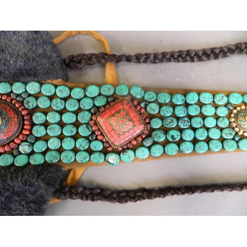 208 - A Tibetan ceremonial tribal hat decorated with coral, turquoise, shell and white metal beads, 33½