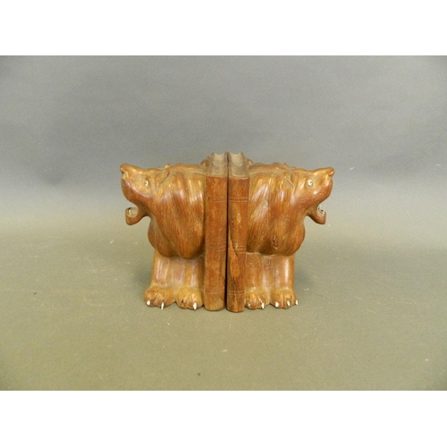 212 - A pair of African wood bookends with carved lion decoration, 6