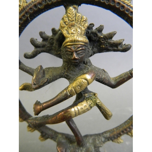 213 - A small Indian brass and copper figure of Shiva, 3½