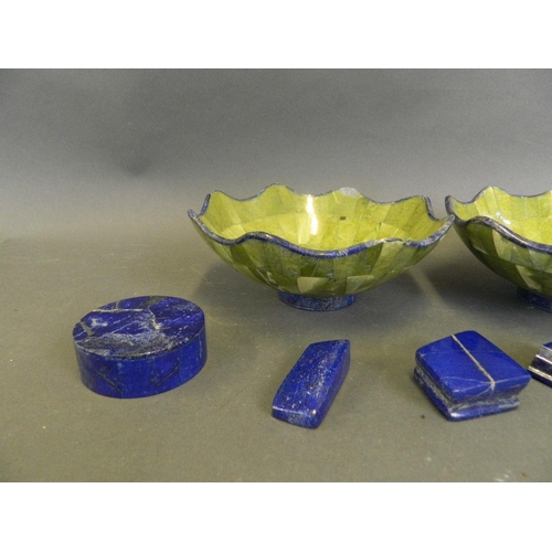 216 - A pair of lapis lazuli and green hardstone bowls with a frilled rim, together with a pair of lapis l... 