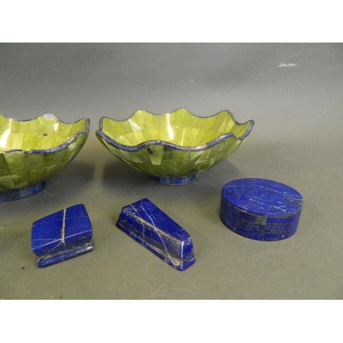 216 - A pair of lapis lazuli and green hardstone bowls with a frilled rim, together with a pair of lapis l... 