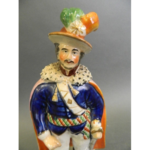 217 - A Staffordshire figure of a prince in ceremonial uniform, 9½