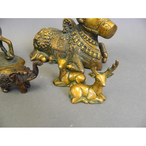 220 - A collection of Eastern cold lacquered bronze figures in the form of a ceremonial cow, horses, stags... 