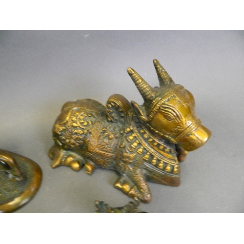 220 - A collection of Eastern cold lacquered bronze figures in the form of a ceremonial cow, horses, stags... 