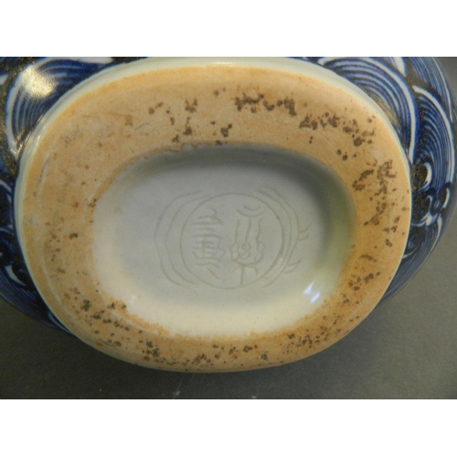 223 - A Chinese blue and white porcelain moon flask with incised dragon decoration, 2 character mark to ba... 