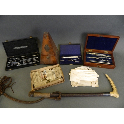 224 - A mahogany cased metronome, together with three cased sets of drawing instruments, a horn handled le... 