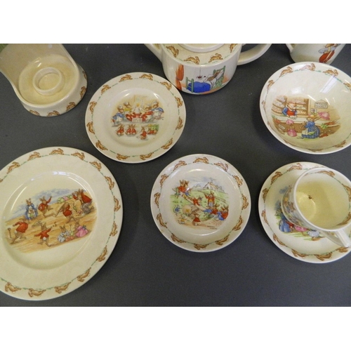 225 - A quantity of Royal Doulton 'Bunnykins' china to include a teapot and night light holder (jug AF)