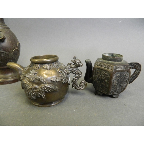 229 - Two Chinese miniature bronze tea pots with cast decoration, and a Japanese bronze vase decorated wit... 