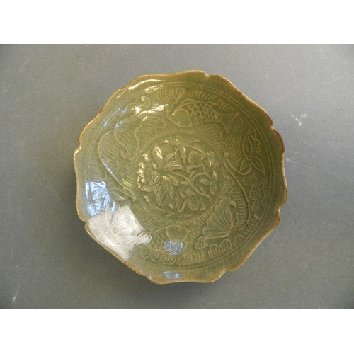 234 - A Chinese Song style green glazed trinket dish with petal shaped rim and incised carp and water lily... 