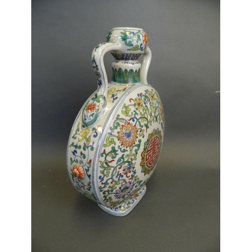 238 - A Chinese twin handled porcelain moon flask with Doucai enamel scrolling lotus flower decoration, se... 