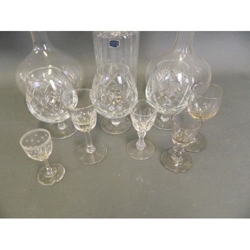 240 - An early blown glass mallet decanter, another similar, a Webbs crystal decanter and three Waterford ... 