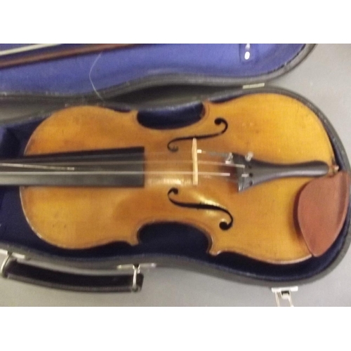 241 - A violin with two piece back, in a fitted case with bow, 22