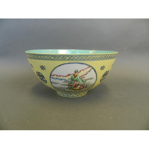 242 - A Chinese famille jaune enamelled porcelain bowl with four decorative panels depicting the Eight Imm... 