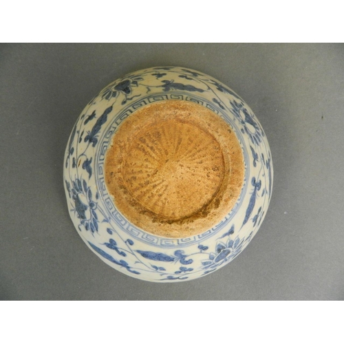 243 - A Chinese Ming style blue and white porcelain bowl with painted floral decoration, 6