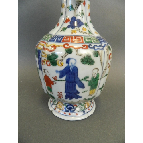 247 - A Chinese Wucai enamel porcelain vase with twin jug handles and painted decoration of figures beneat... 