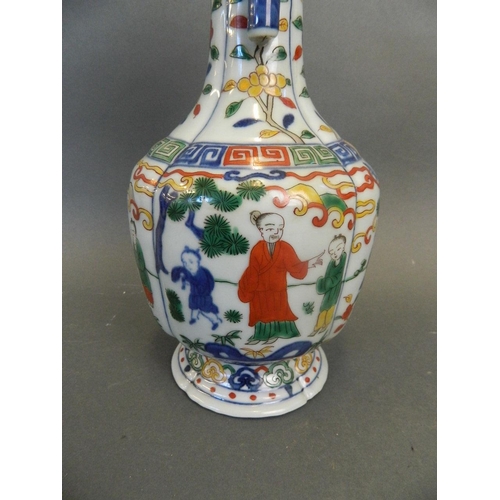 247 - A Chinese Wucai enamel porcelain vase with twin jug handles and painted decoration of figures beneat... 