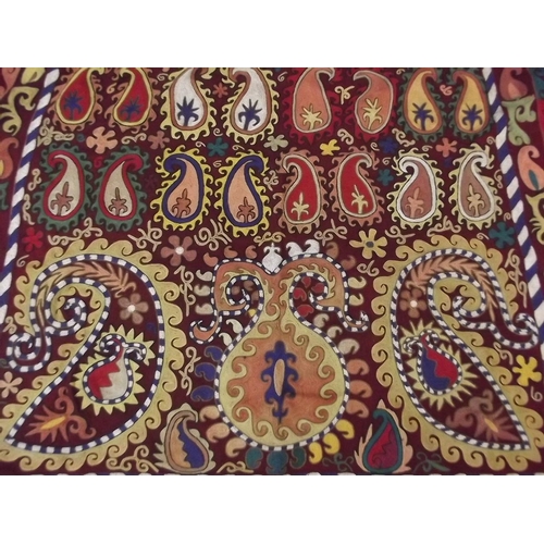 250D - A colourful Uzbek silk embroidery on a deep red field, 55