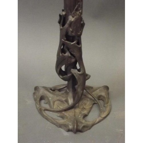 250L - A pair of Art Nouveau bronzed spelter candlesticks, 26