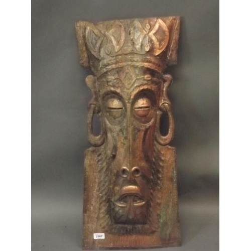 250P - E. Chibale, a hammered copper mask, possibly African, 31