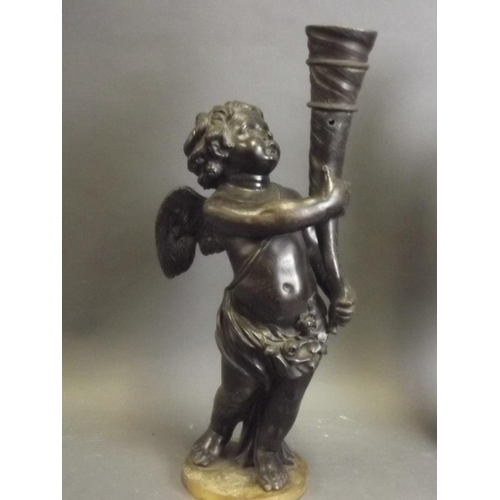 250Q - A pair of late C19th/early C20th bronze lamps in the form of cherubs bearing cornucopia, 15½