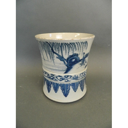 255 - A Chinese blue and white porcelain brush pot decorated with figures in a garden and fishing scenes, ... 