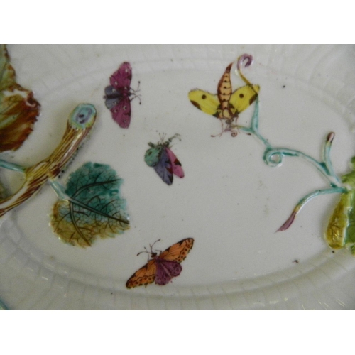 26 - A pair of late C18th/early C19th porcelain oval dishes with moulded leaf and painted butterfly decor... 