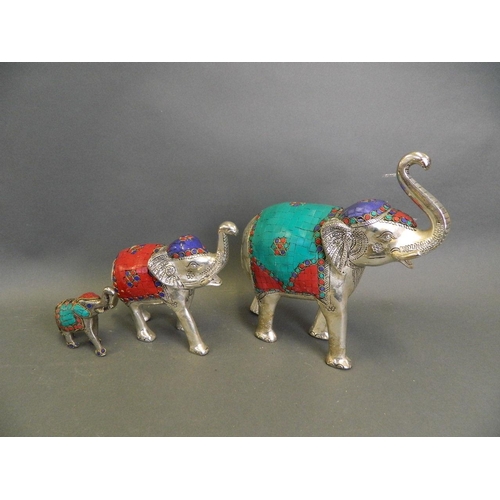 261 - A Middle Eastern mixed metal figure group of a parade of elephants with inset composite decoration, ... 