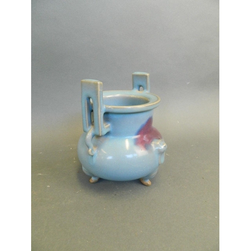 270 - A Chinese blue ground Jun ware twin handled censer with flambé glaze decoration, on tripod feet, 6