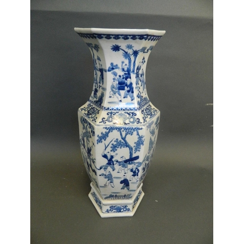 274 - A Chinese blue and white porcelain vase of hexagonal form decorated with figures in procession, 6 ch... 