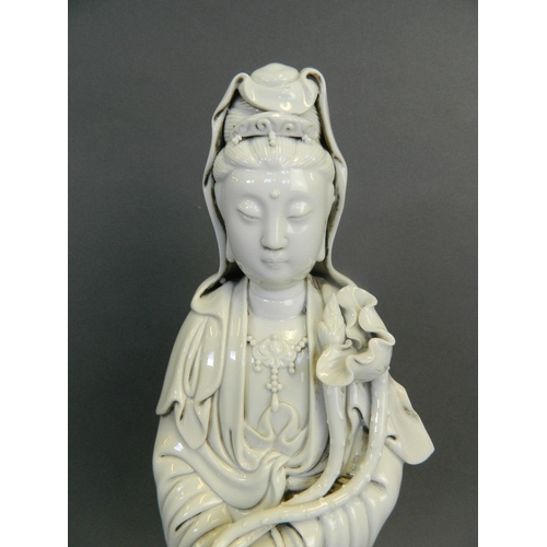 282 - A Chinese Blanc de Chine porcelain figure of Quan Yin holding a ruyi, seal mark verso, 15½